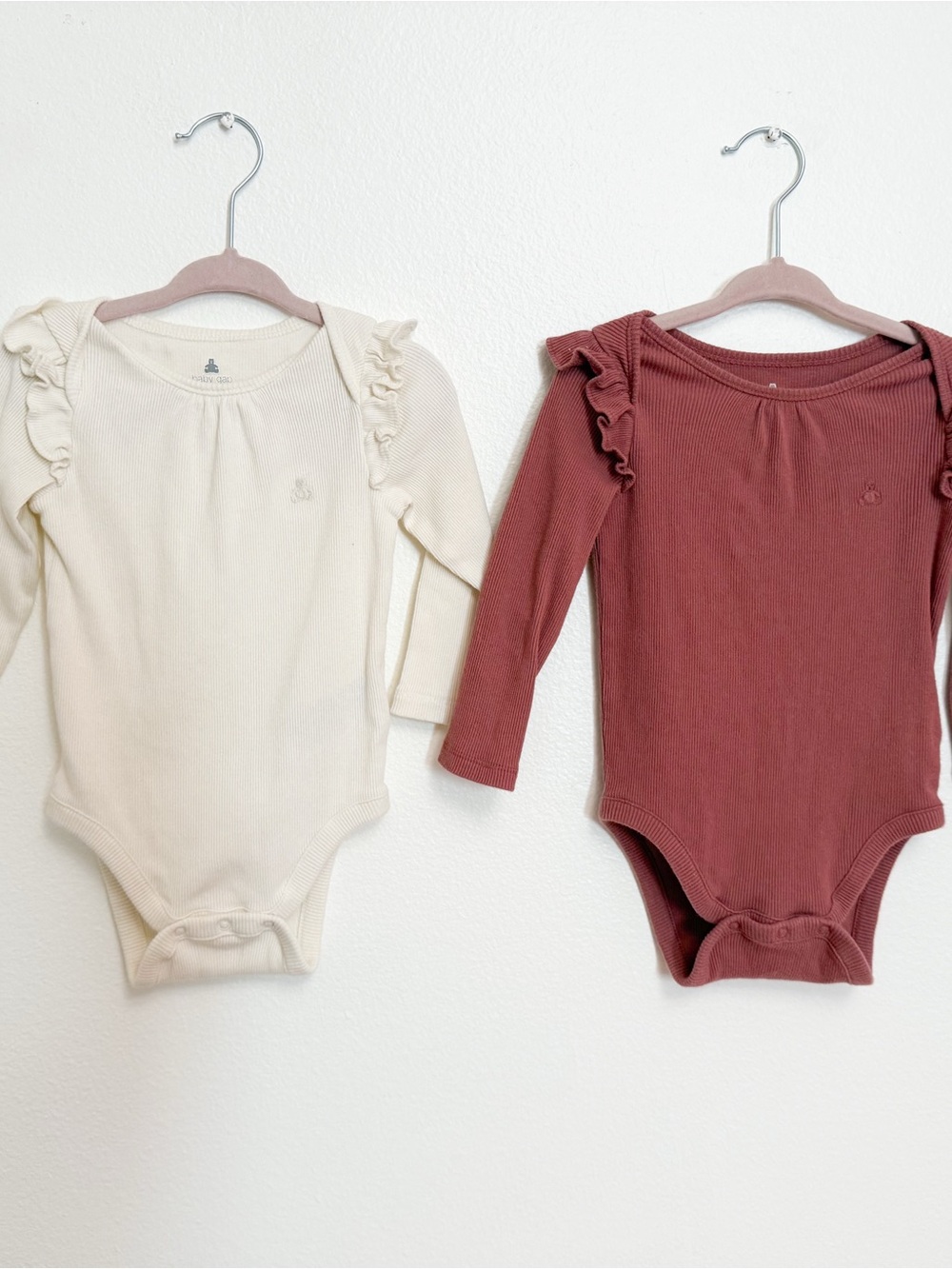 GAP Ruffle Shoulder Ribbed One-Piece Bodysuits in Cream and Dusty Rose